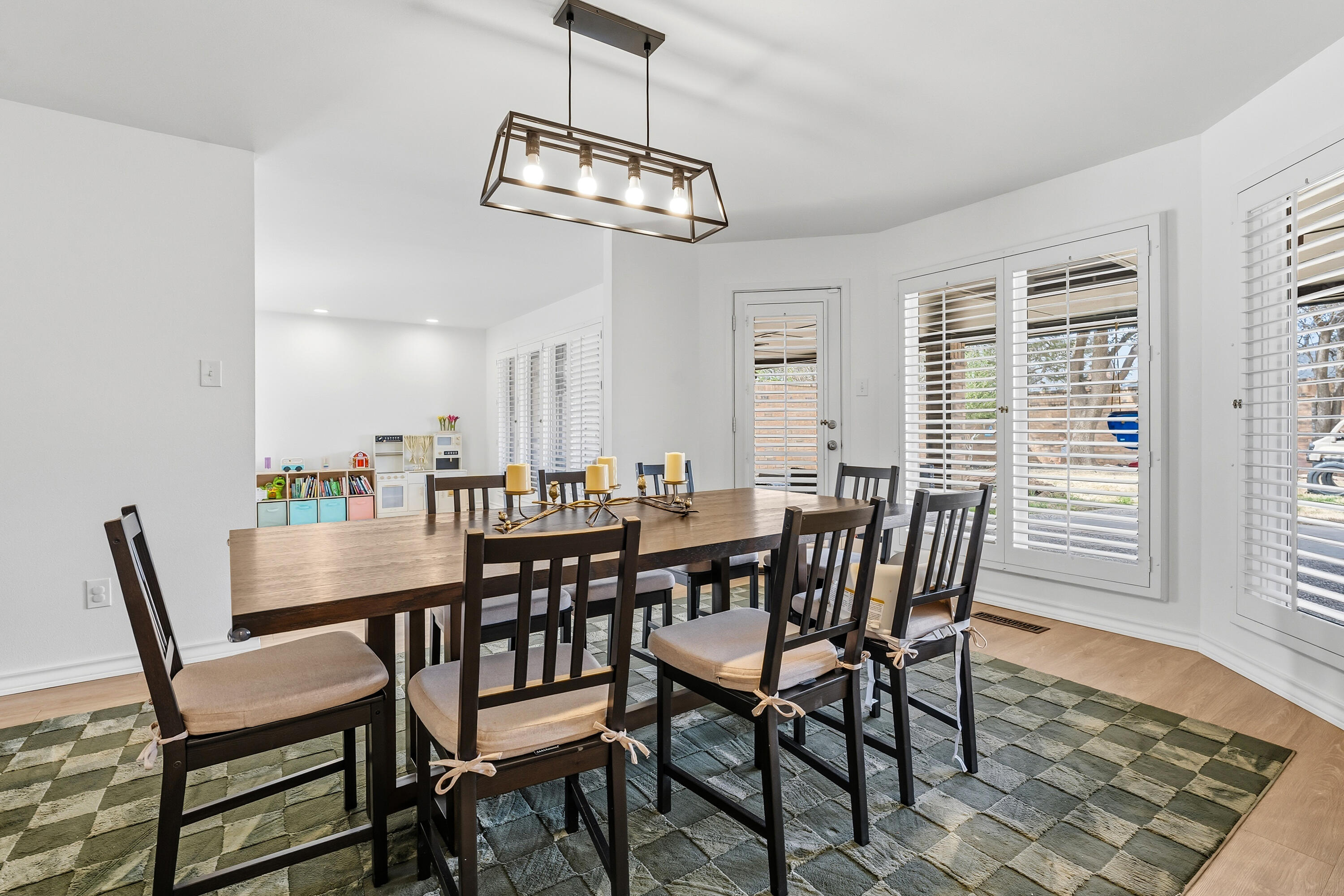 4628 94th Street Lubbock, TX 79424 - Photo 19 of 41 a view of a dining room with furniture window and wooden floor