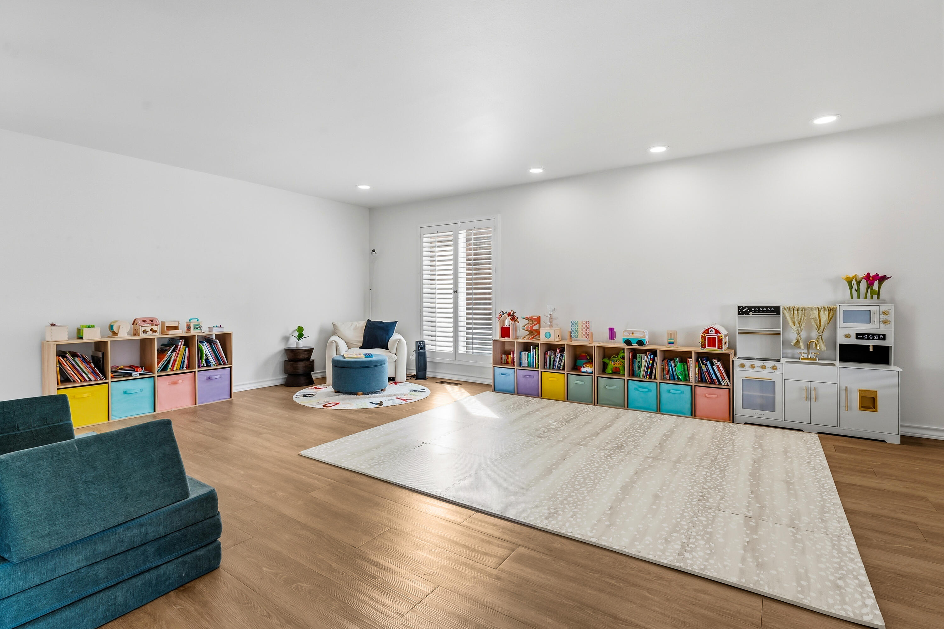4628 94th Street Lubbock, TX 79424 - Photo 21 of 41 a living room with furniture and a wooden floor