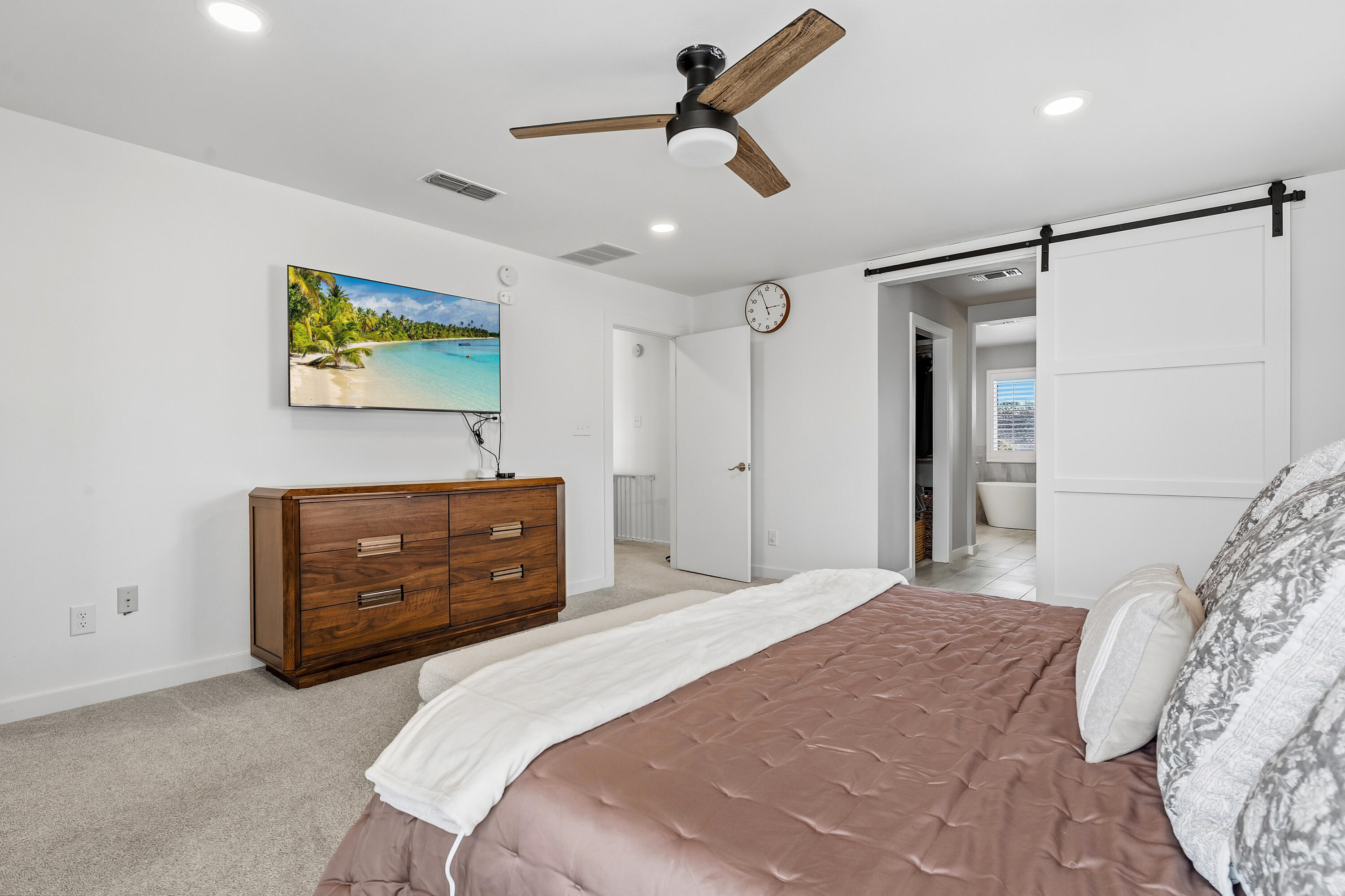 4628 94th Street Lubbock, TX 79424 - Photo 26 of 41 a bedroom with a bed and a dresser