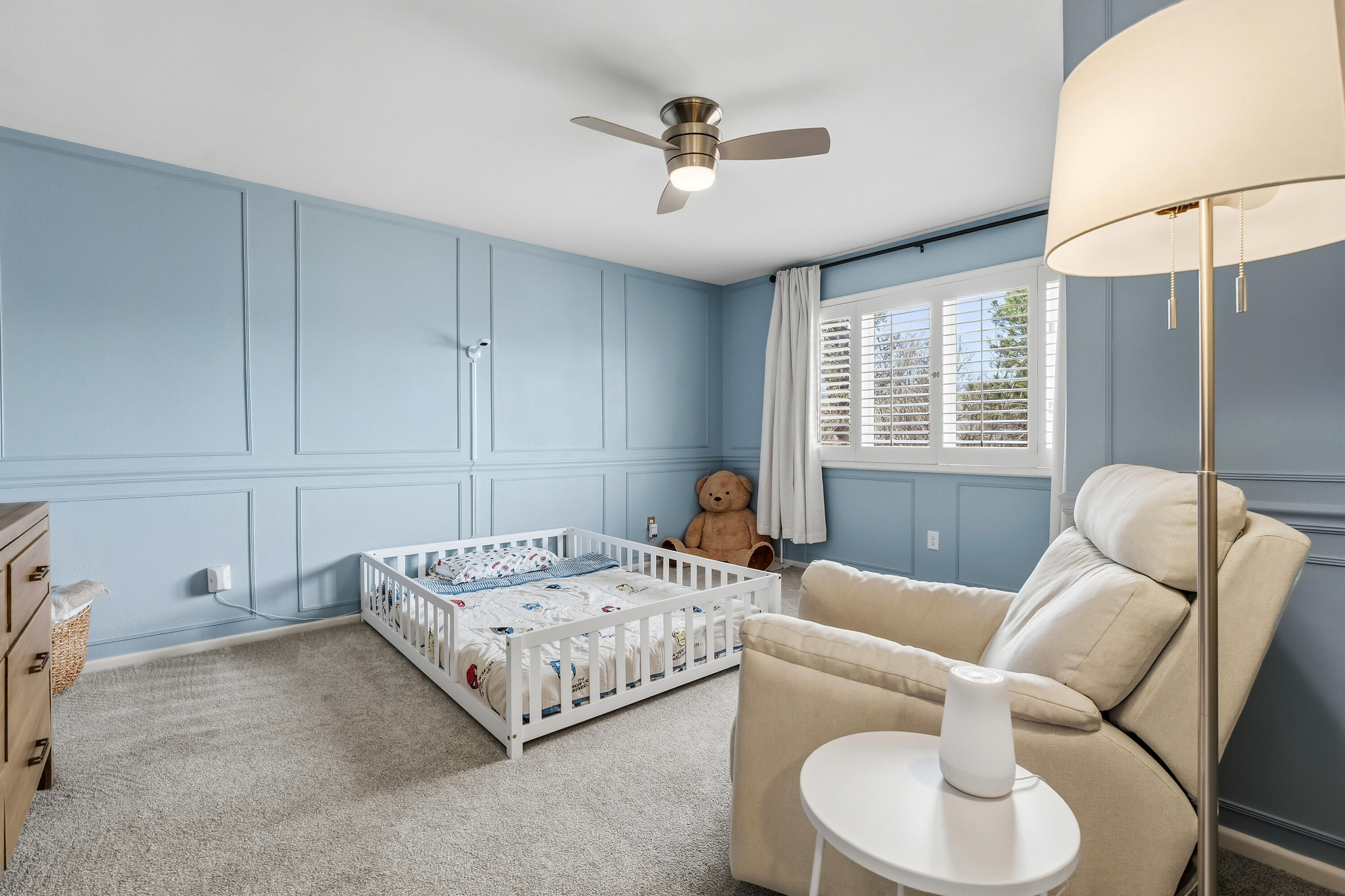 4628 94th Street Lubbock, TX 79424 - Photo 34 of 41 a bedroom with a bed and a couch