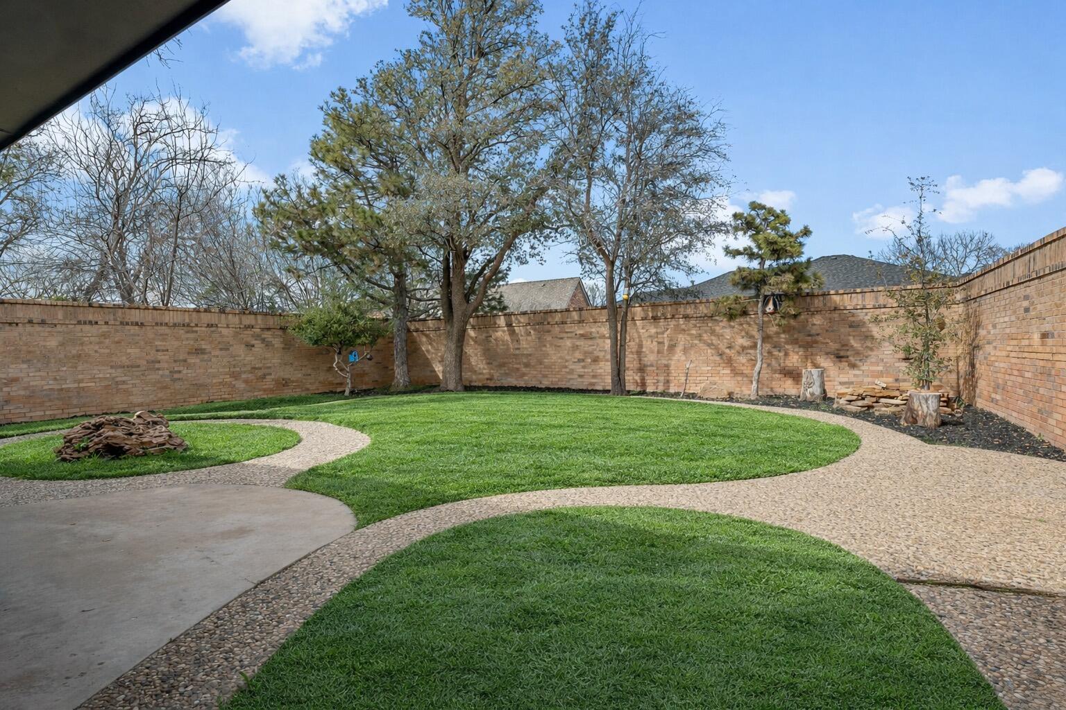 4628 94th Street Lubbock, TX 79424 - Photo 40 of 41 a view of a yard with a large tree
