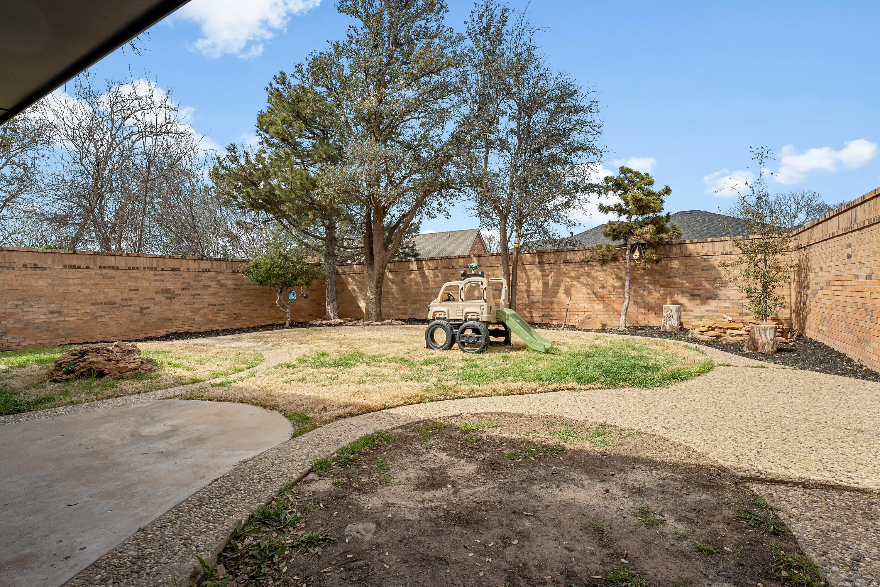 4628 94th Street Lubbock, TX 79424 - Photo 41 of 41 a view of a yard with yellow lighting