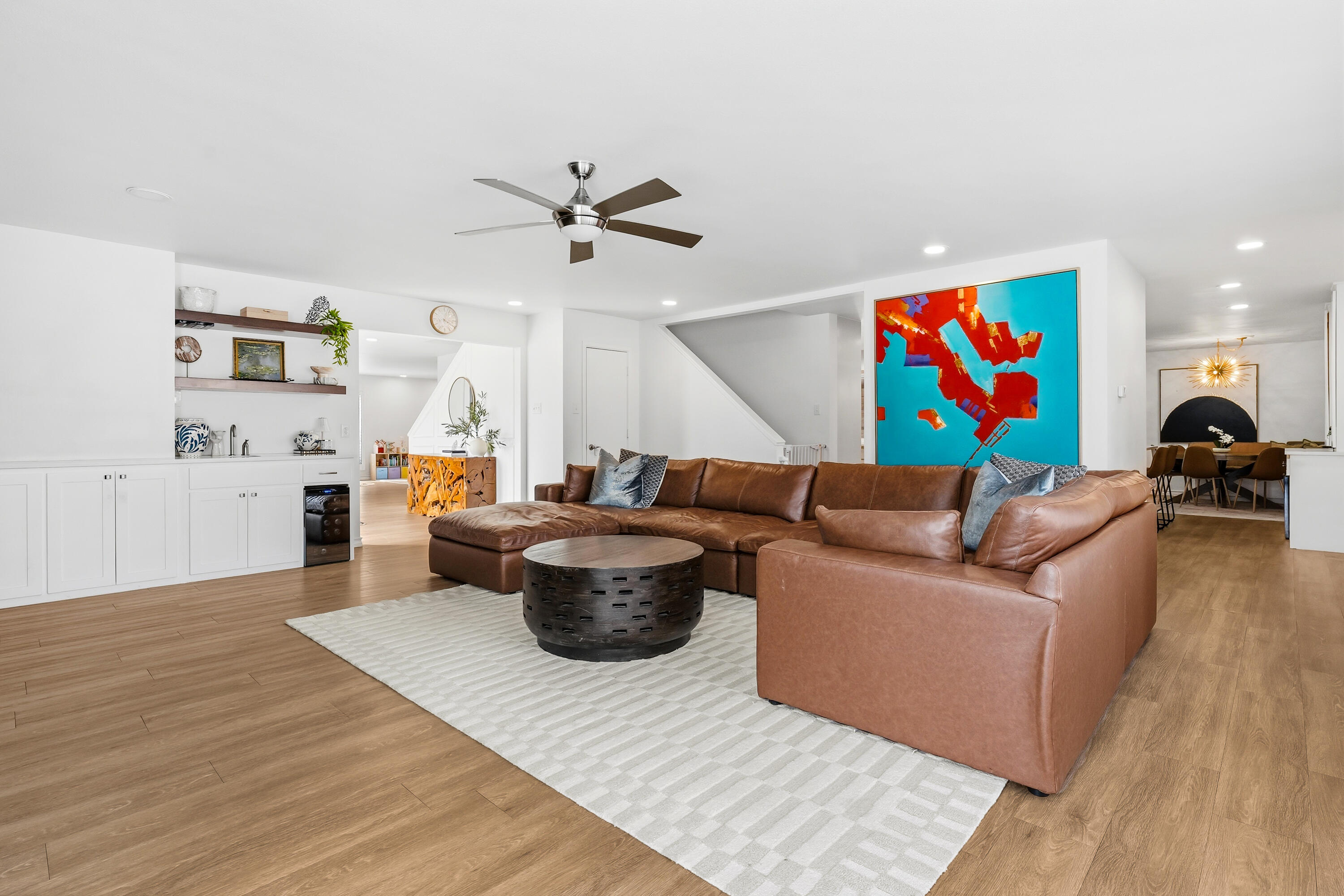 4628 94th Street Lubbock, TX 79424 - Photo 9 of 41 a living room with furniture a rug and a ceiling fan
