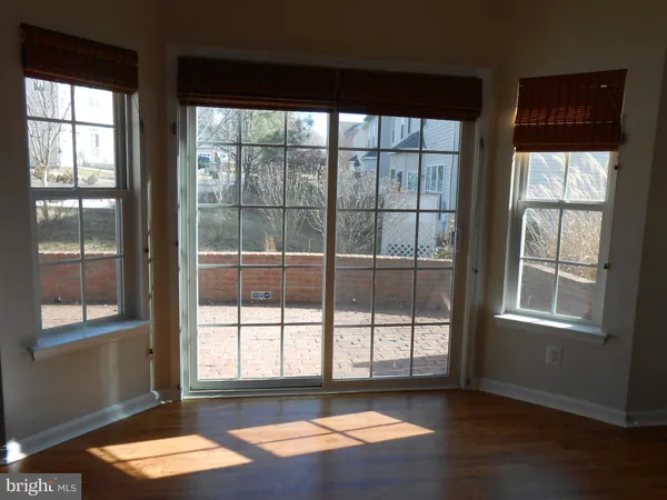 a view of a room with large windows