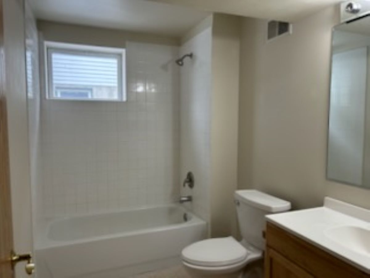 711 Prospect Street Kirkland, IL 60146 - Photo 15 of 23 a white toilet sitting next to a bath tub