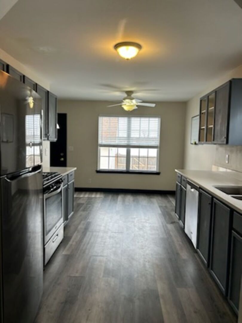 711 Prospect Street Kirkland, IL 60146 - Photo 5 of 23 a view of an empty room with window and wooden floor