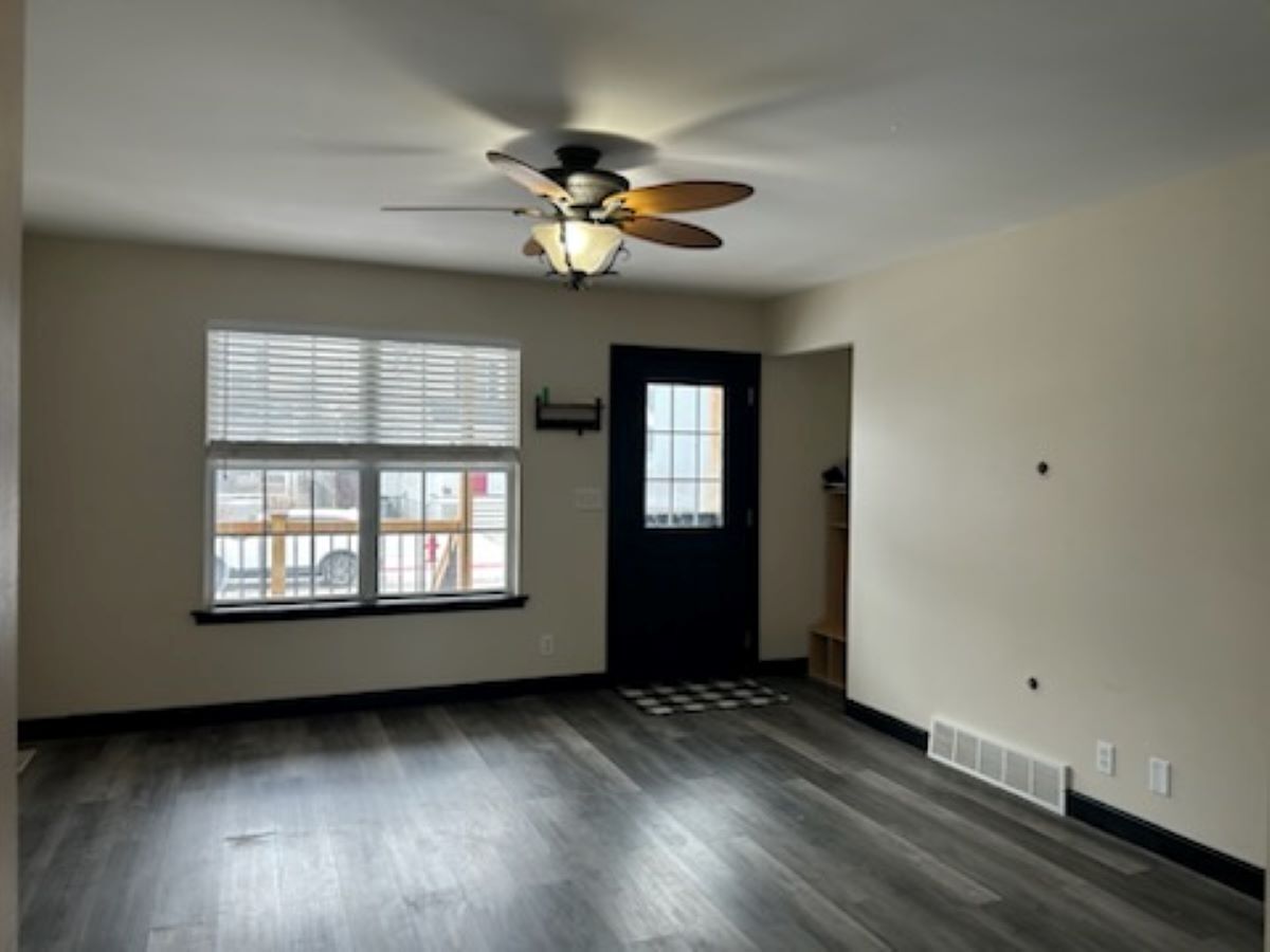 711 Prospect Street Kirkland, IL 60146 - Photo 7 of 23 a view of a livingroom with a ceiling fan and window