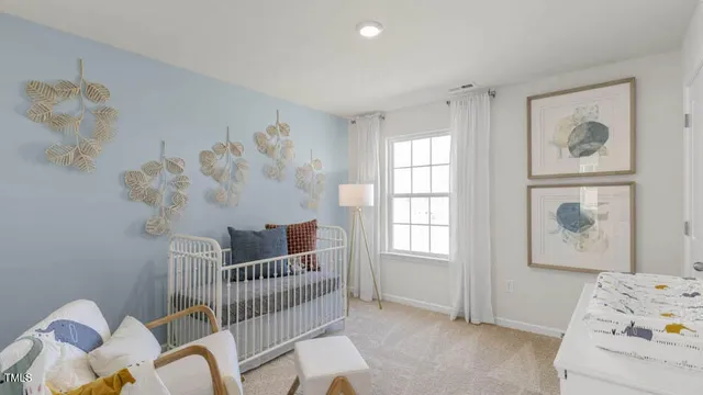 a bedroom with furniture and a window