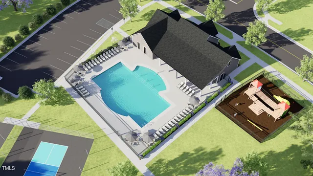 an aerial view of a house with a yard and lake view