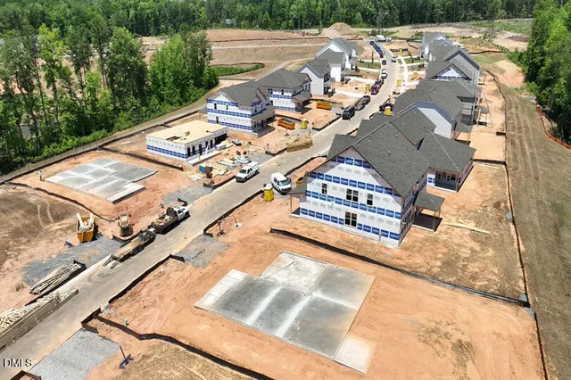 an aerial view of a house with a garden