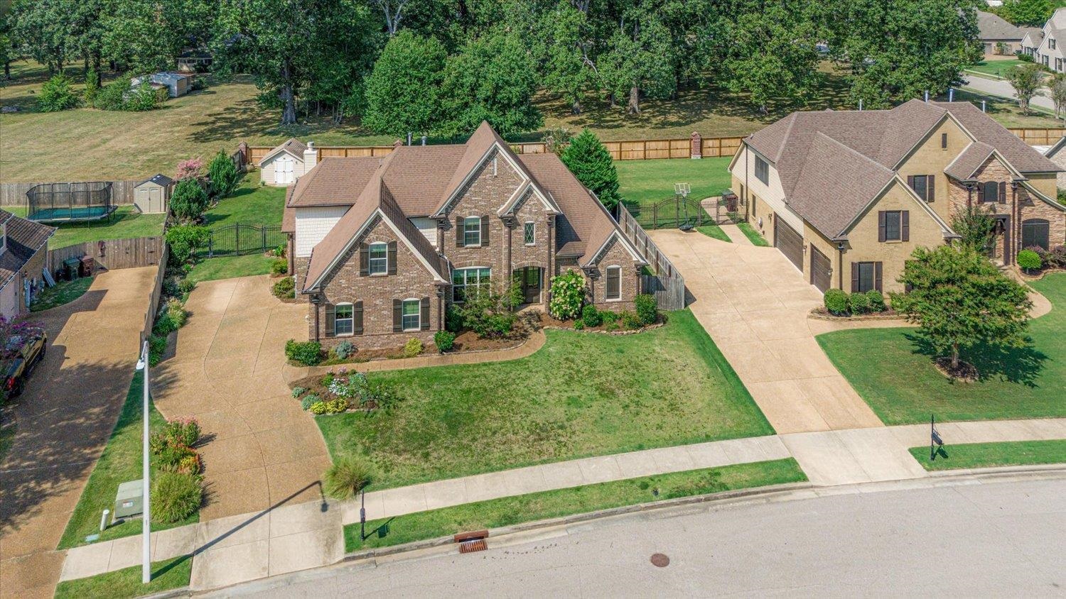 an aerial view of house with yard