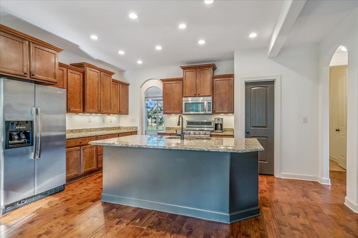 1349 Beautiful Place Collierville, TN 38017 - Photo 20 of 40 a kitchen with stainless steel appliances granite countertop a sink a stove and a refrigerator