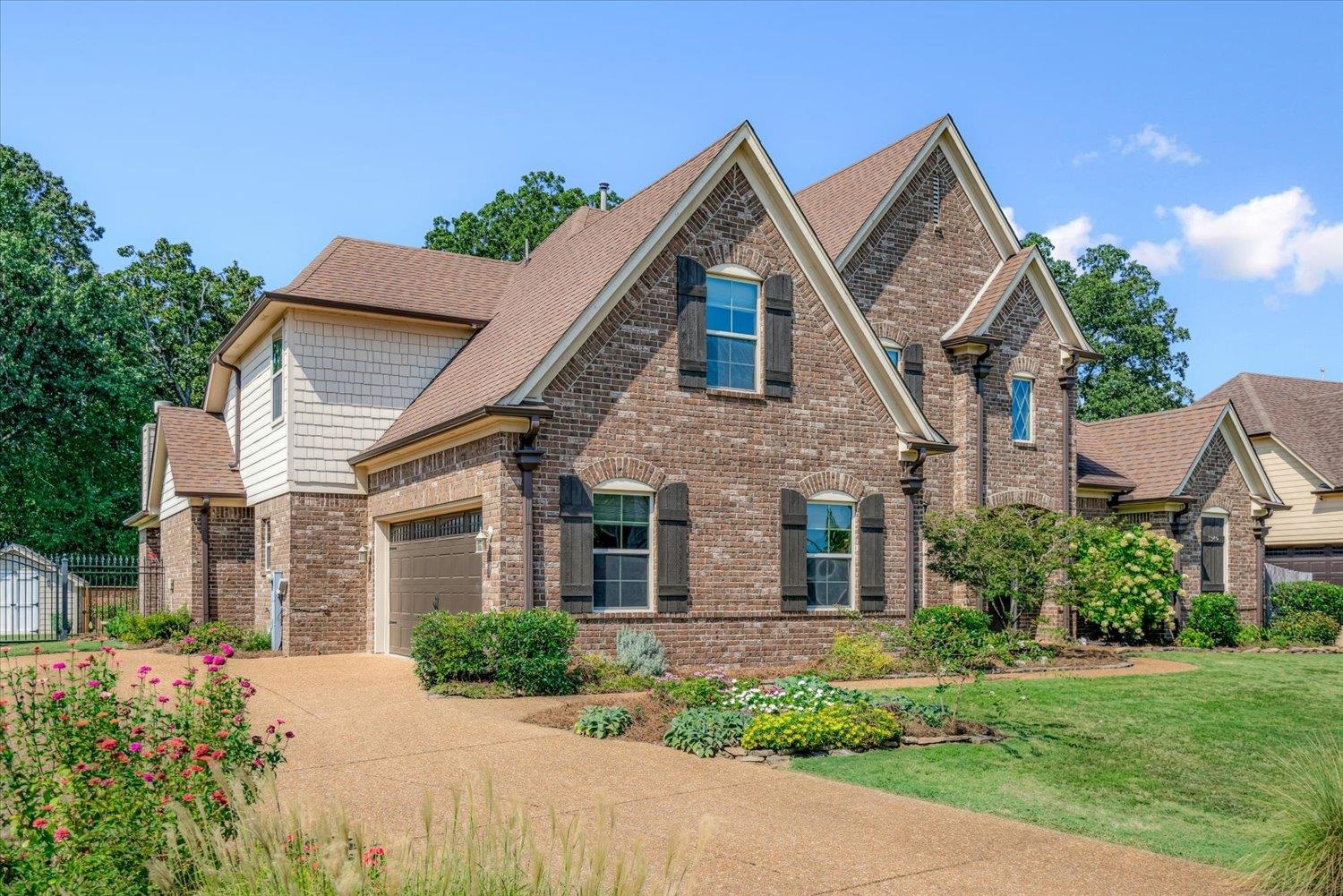 1349 Beautiful Place Collierville, TN 38017 - Photo 2 of 40 a front view of a house with a yard