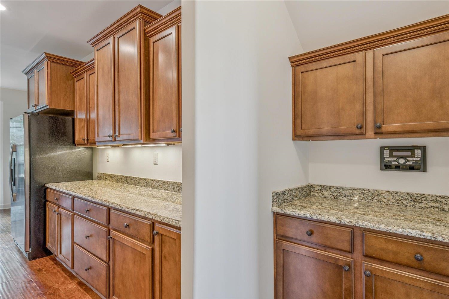 1349 Beautiful Place Collierville, TN 38017 - Photo 22 of 40 a kitchen with stainless steel appliances granite countertop a refrigerator and a sink