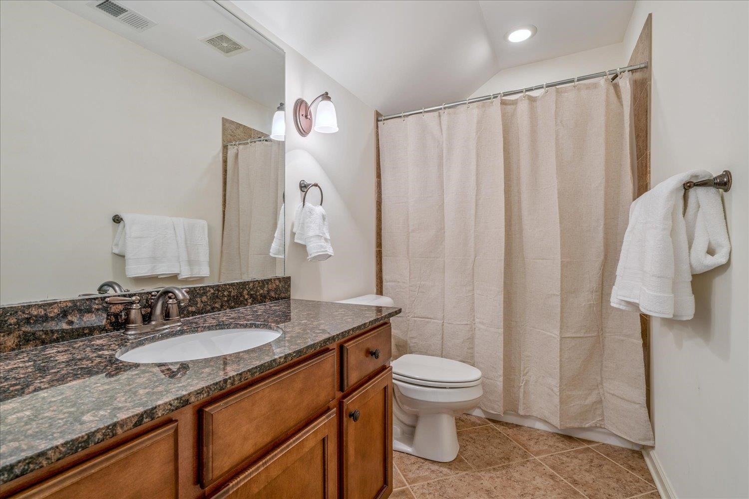 1349 Beautiful Place Collierville, TN 38017 - Photo 40 of 40 a bathroom with a granite countertop sink toilet and shower