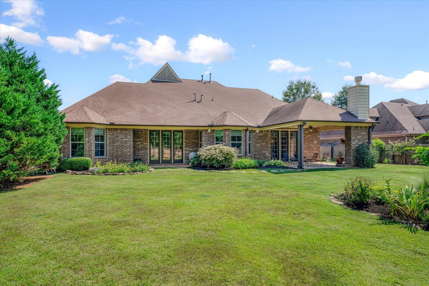 1349 Beautiful Place Collierville, TN 38017 - Photo 8 of 40 a front view of a house with a garden