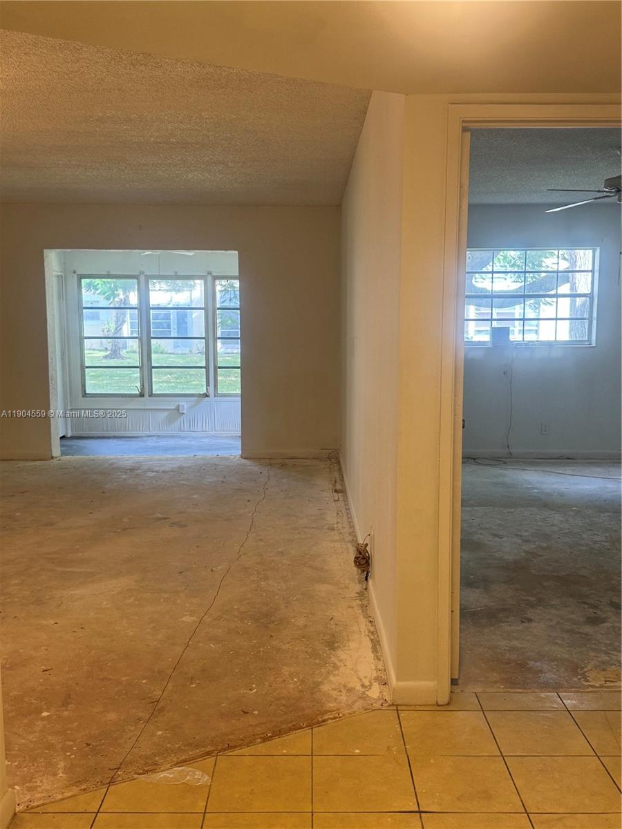 5640 Southwest 3rd Place, Unit 110 Margate, FL 33068 - Photo 19 of 28 a view of an empty room with window