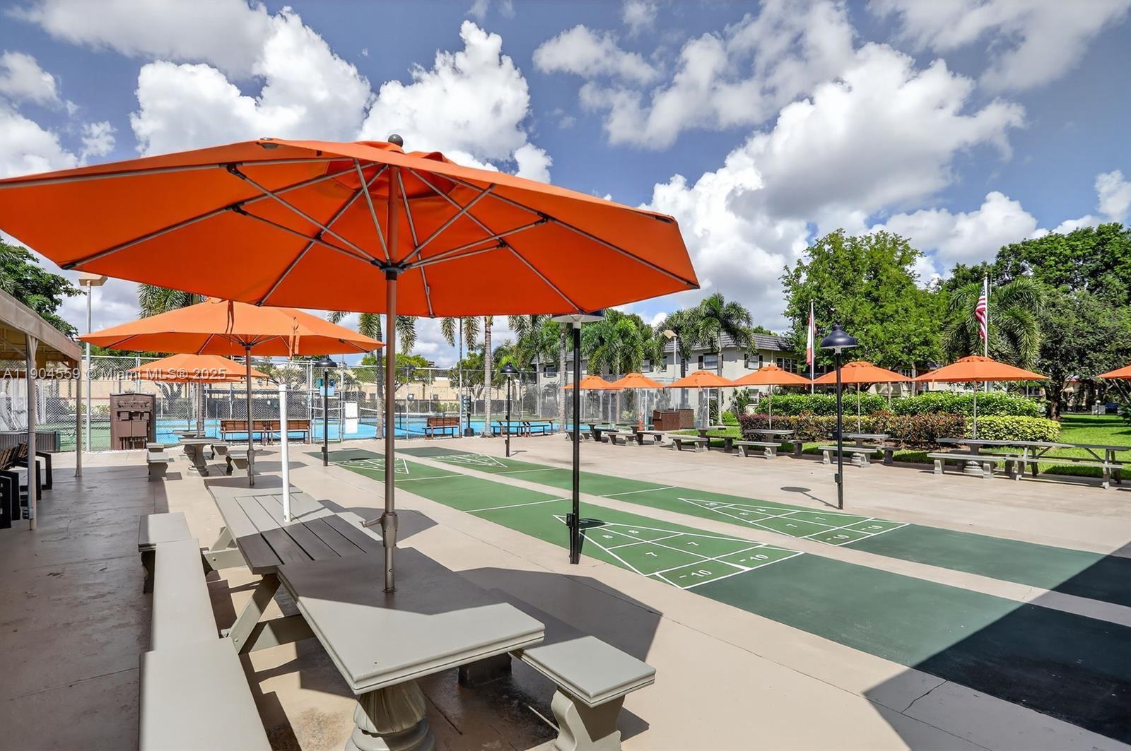 5640 Southwest 3rd Place, Unit 110 Margate, FL 33068 - Photo 2 of 28 a view of a backyard with sitting area