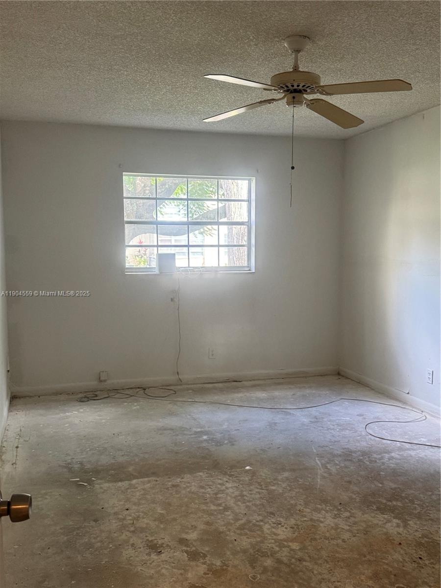 5640 Southwest 3rd Place, Unit 110 Margate, FL 33068 - Photo 24 of 28 a view of an empty room with a window