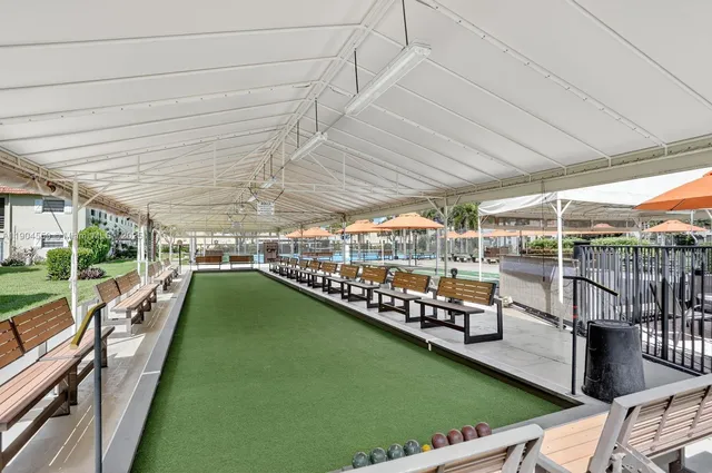 a view of a swimming pool with a patio