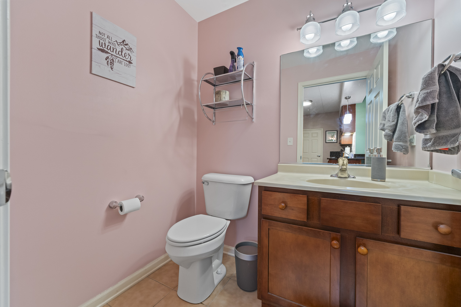 9530 Cook Avenue, Unit 211 Oak Lawn, IL 60453 - Photo 12 of 34 a bathroom with a toilet a sink and mirror