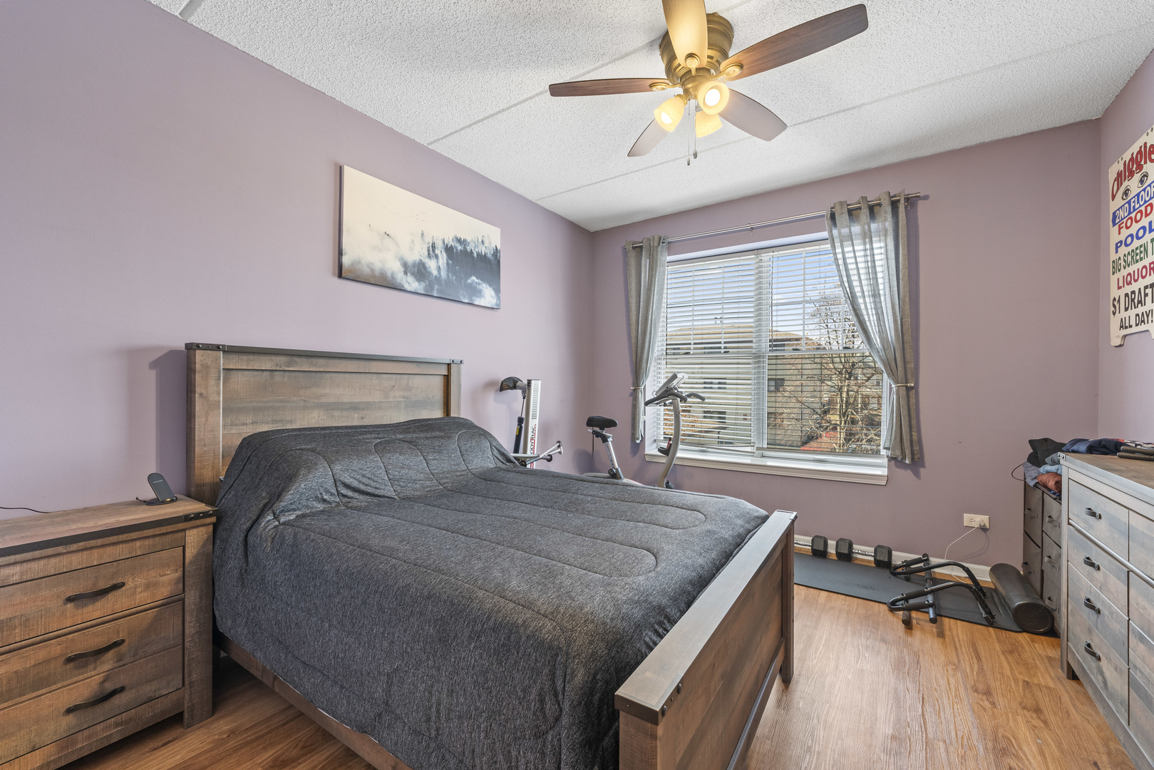 9530 Cook Avenue, Unit 211 Oak Lawn, IL 60453 - Photo 13 of 34 a bedroom with a bed and a chandelier