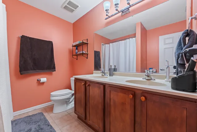 a view of walk in closet with clothes