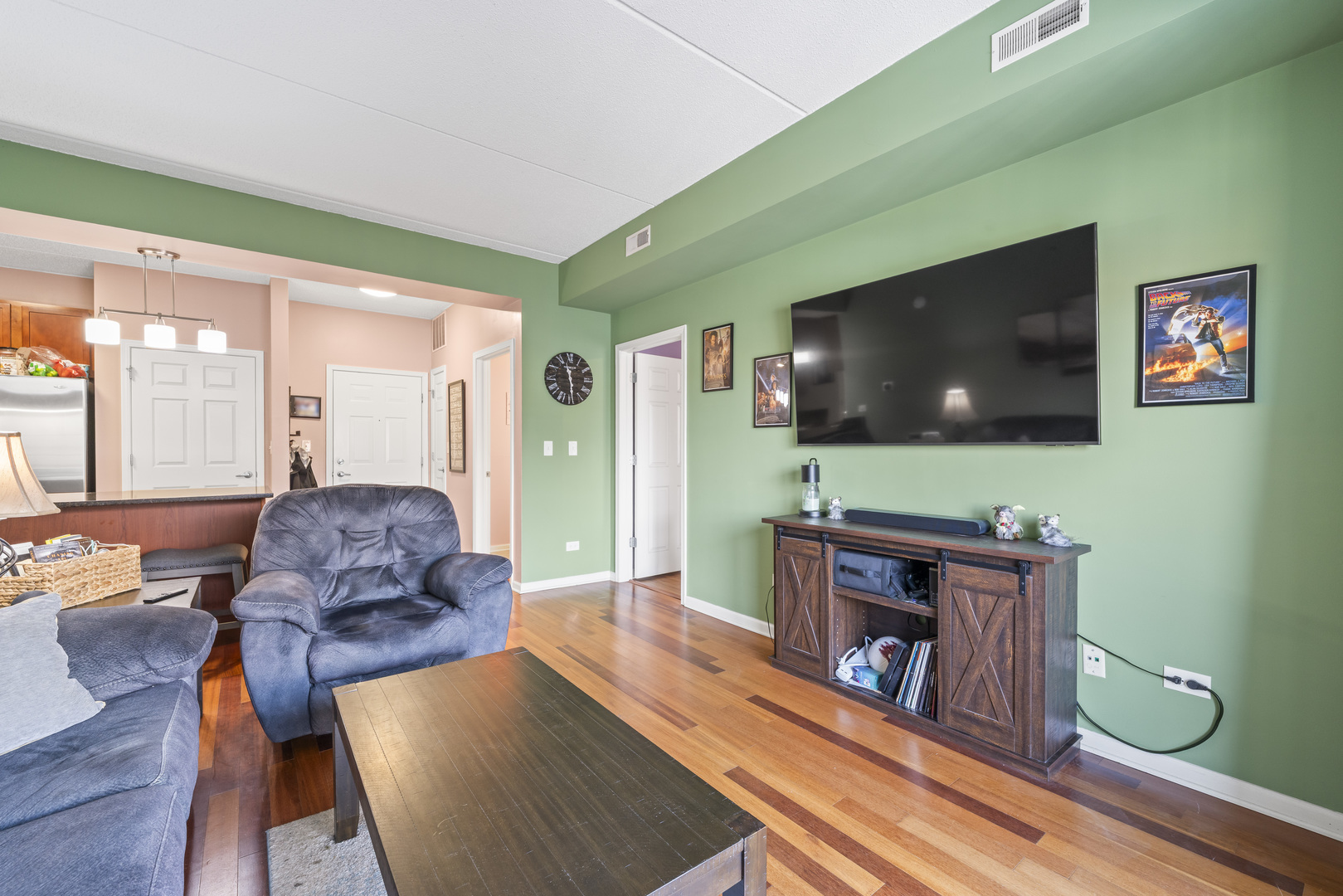 9530 Cook Avenue, Unit 211 Oak Lawn, IL 60453 - Photo 3 of 34 a living room with furniture and a flat screen tv