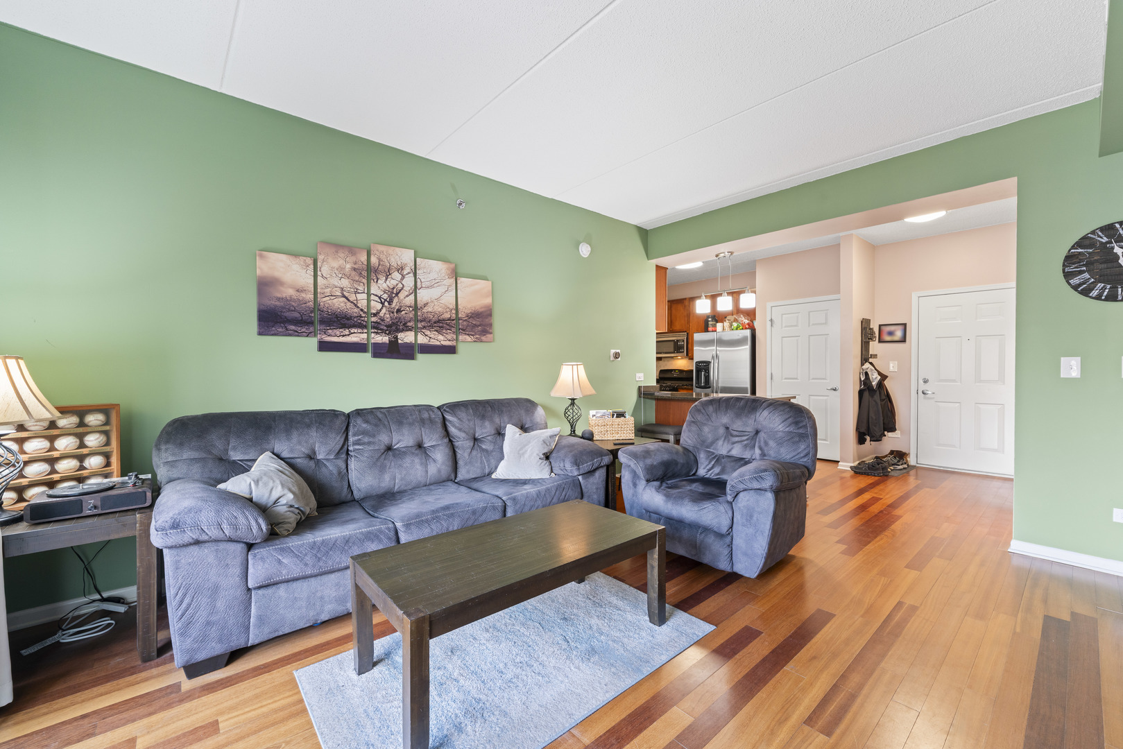 9530 Cook Avenue, Unit 211 Oak Lawn, IL 60453 - Photo 5 of 34 a living room with furniture and a wooden floor