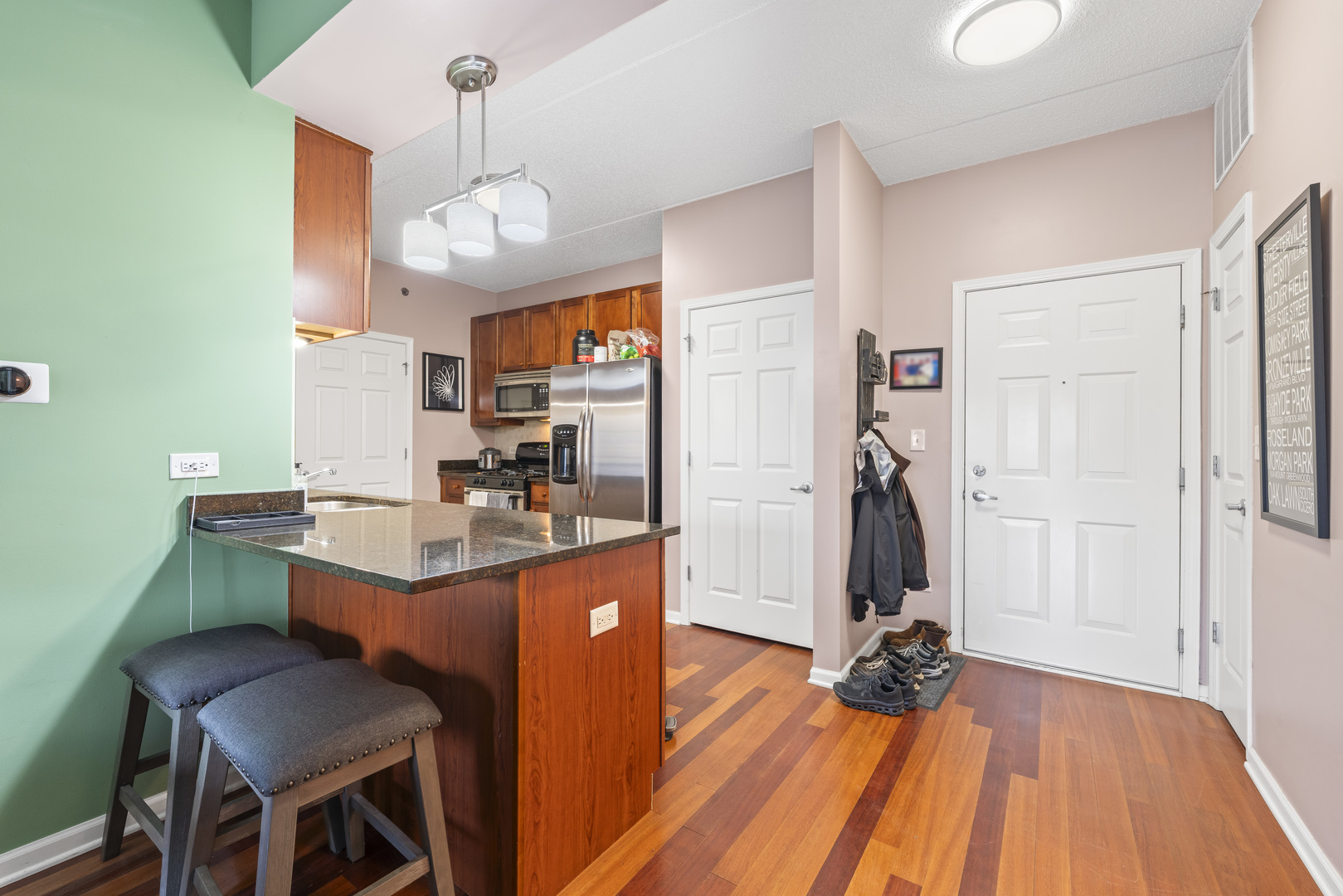 9530 Cook Avenue, Unit 211 Oak Lawn, IL 60453 - Photo 8 of 34 a dining hall with a dining table and chairs with wooden floor