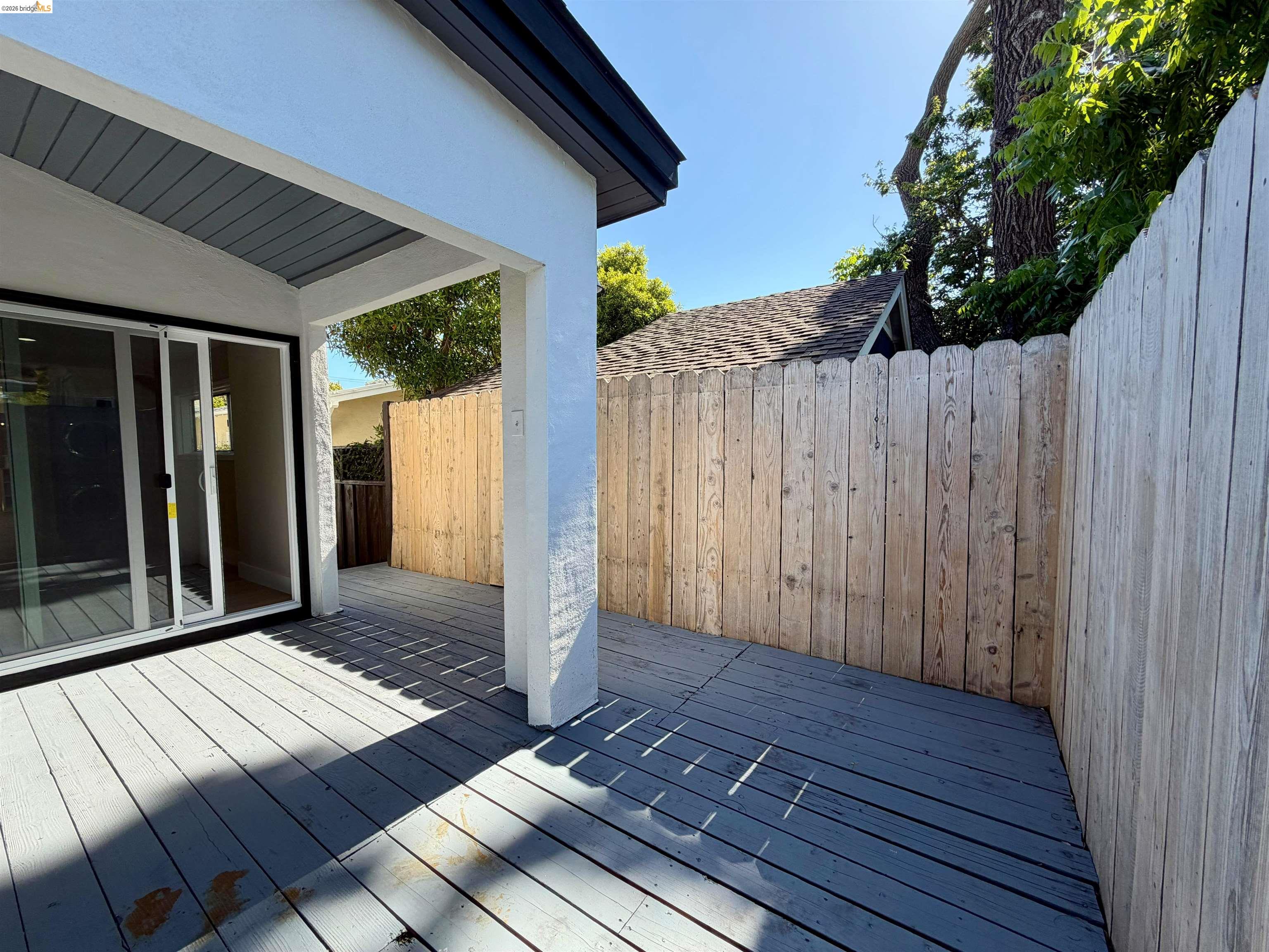 1327 Ward Street Berkeley, CA 94702 - Photo 8 of 8 a view of backyard with wooden deck