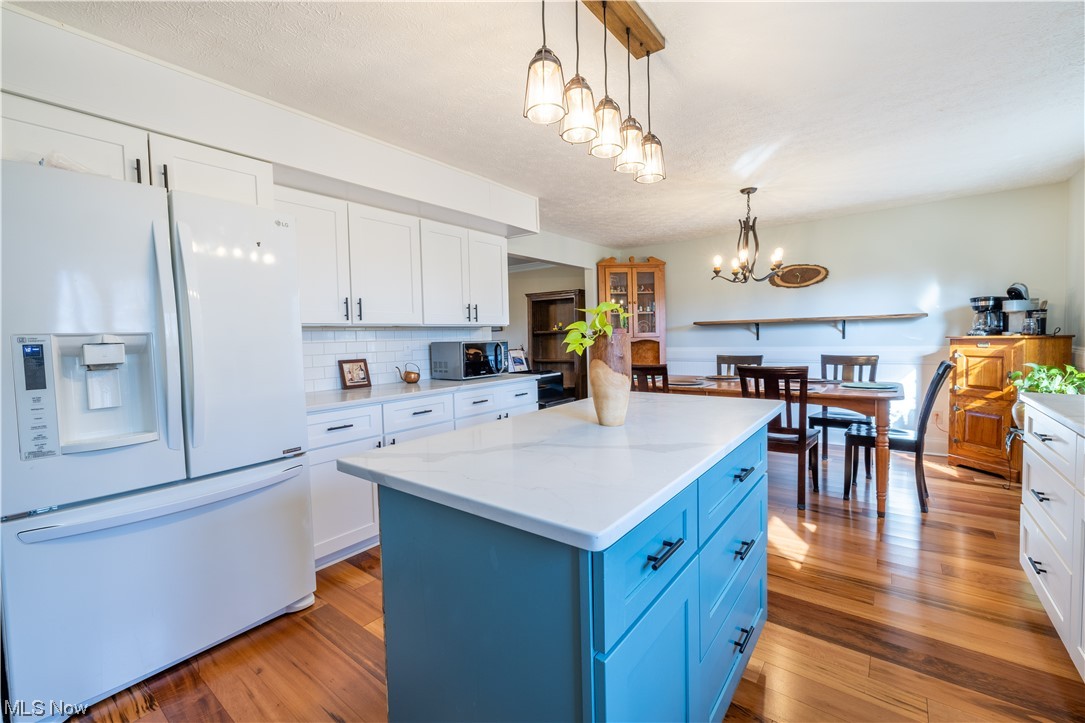 2831 Stiegler Road Medina, OH 44256 - Photo 6 of 32 White shaker cabinets on the perimeter and a two-toned island for a pop of color!