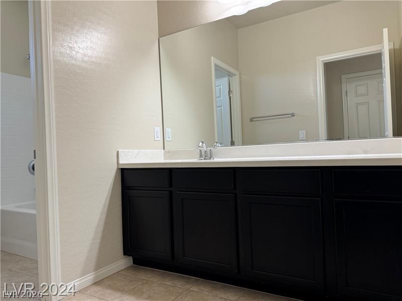 9056 Tony Ridge Avenue Las Vegas, NV 89148 - Photo 22 of 32 Functional vanity with ample counter space and well-appointed fixtures awaits.
