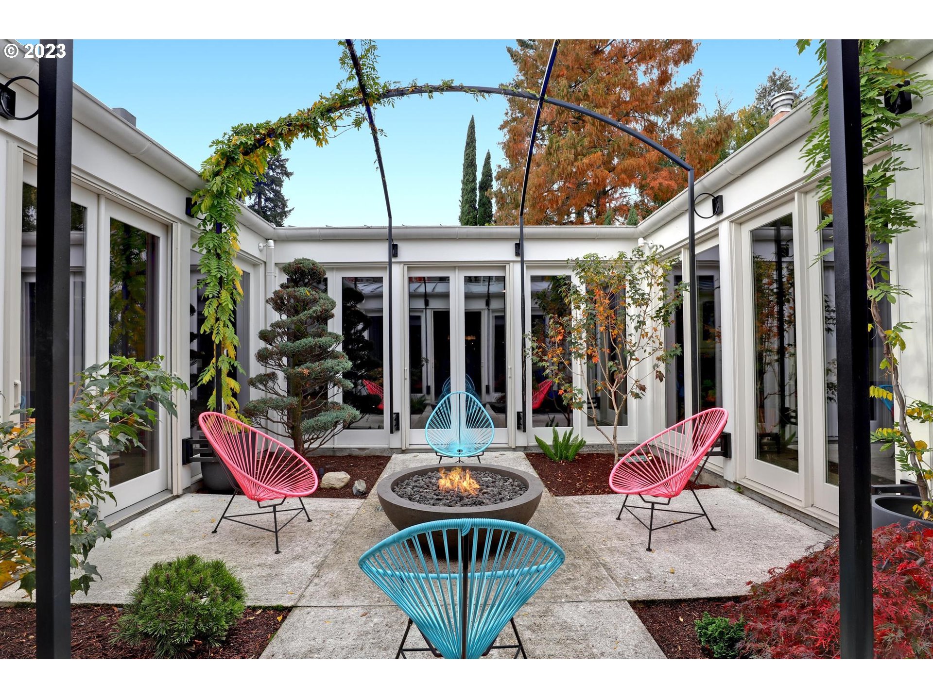 2122 Southwest Myrtle Street Portland, OR 97201 - Photo 18 of 47 a view of a patio with a dining table and chairs