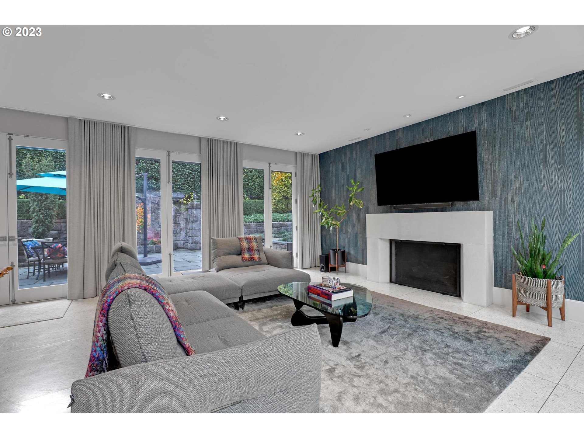 2122 Southwest Myrtle Street Portland, OR 97201 - Photo 21 of 47 a living room with furniture a fireplace and a flat screen tv