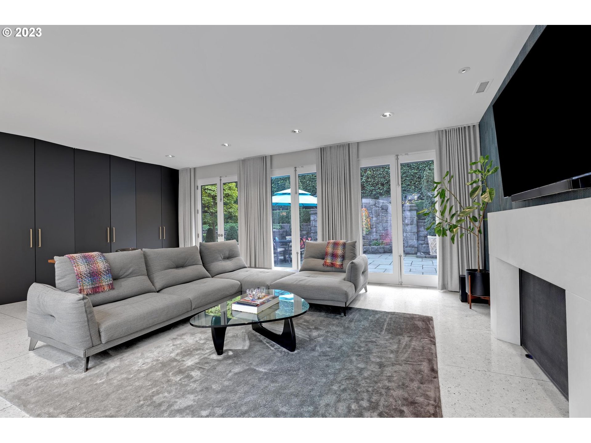 2122 Southwest Myrtle Street Portland, OR 97201 - Photo 22 of 47 a living room with furniture flat screen tv and a fireplace