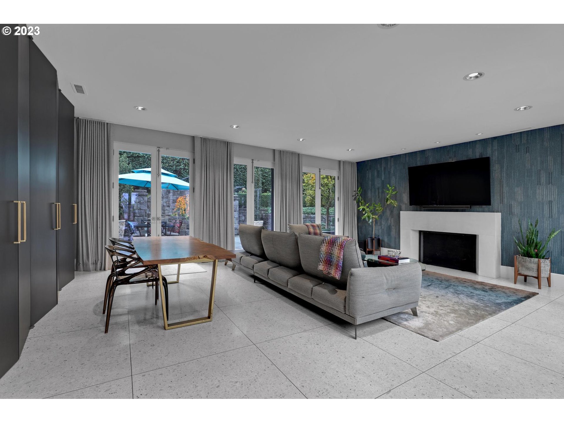 2122 Southwest Myrtle Street Portland, OR 97201 - Photo 23 of 47 a living room with furniture a flat screen tv and a fireplace