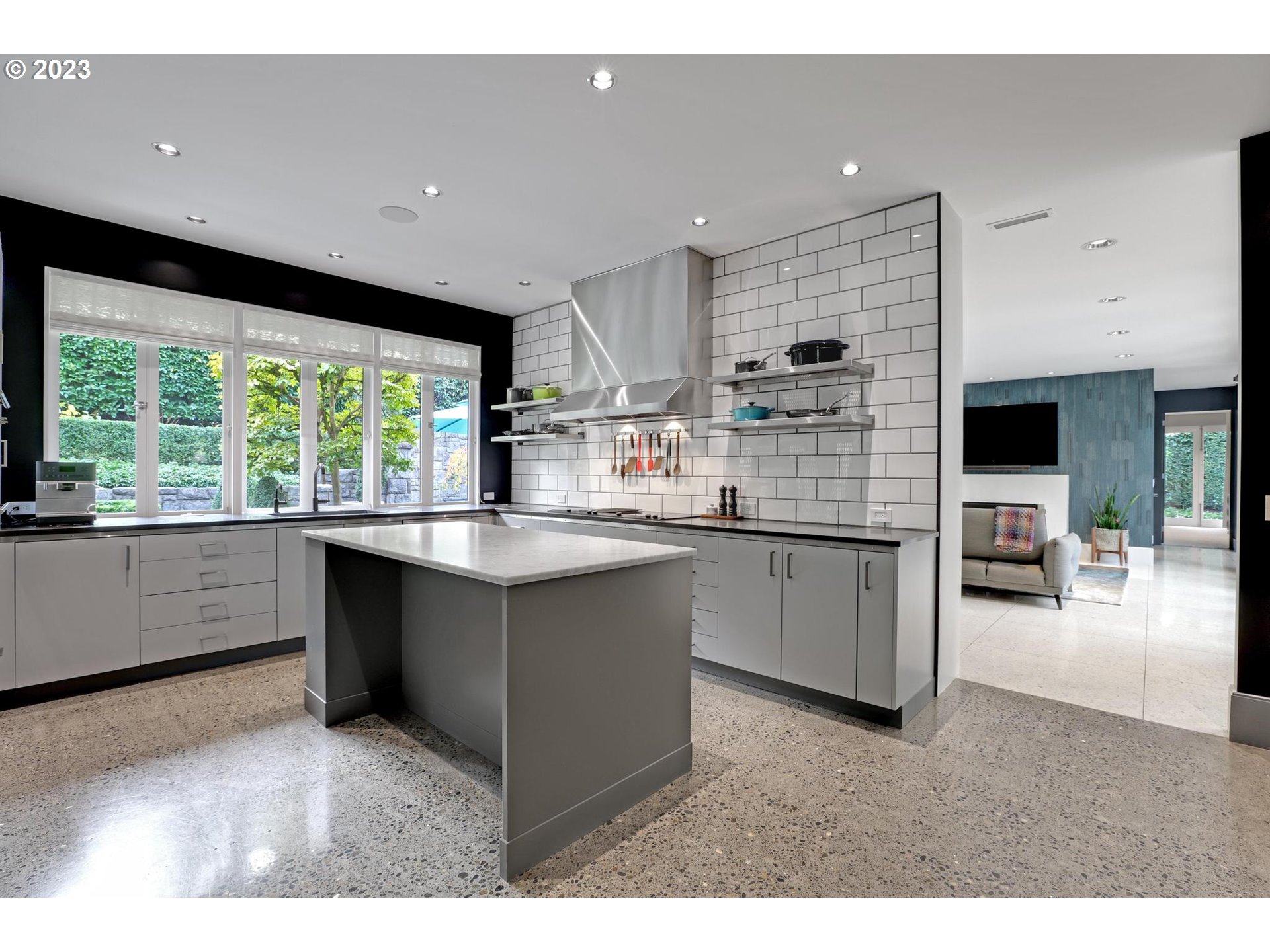 2122 Southwest Myrtle Street Portland, OR 97201 - Photo 26 of 47 a kitchen with kitchen island sink and large window