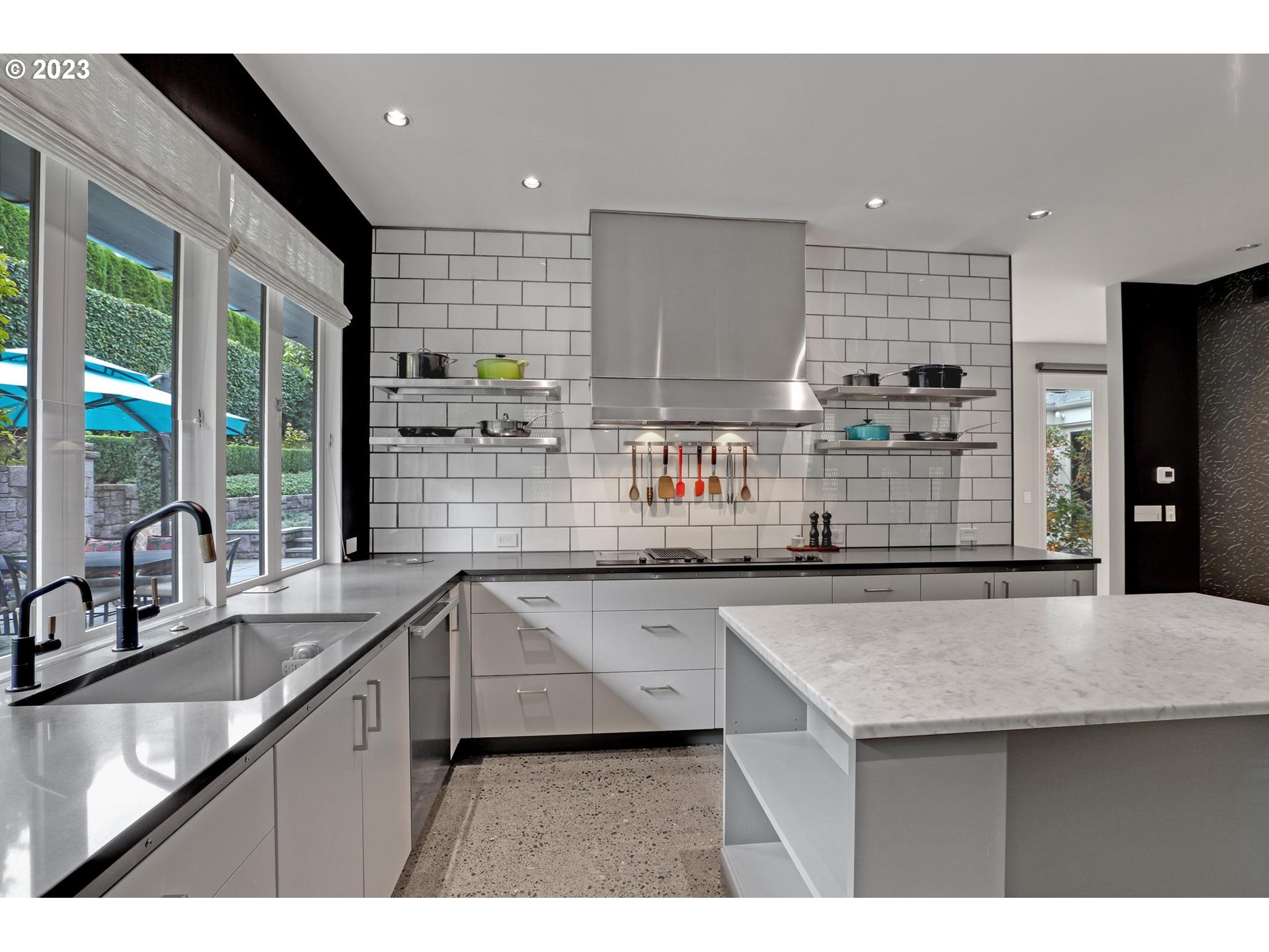 2122 Southwest Myrtle Street Portland, OR 97201 - Photo 28 of 47 a kitchen with stainless steel appliances a sink and a stove