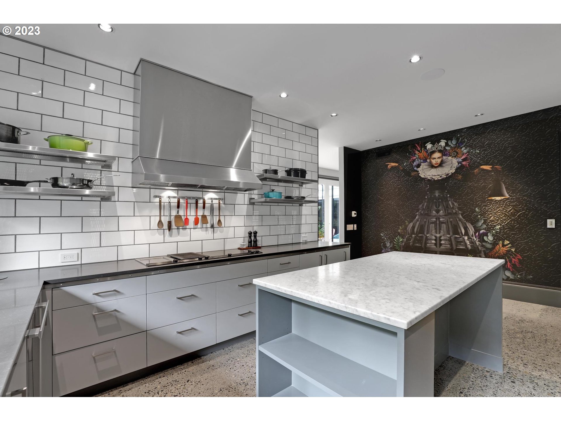 2122 Southwest Myrtle Street Portland, OR 97201 - Photo 29 of 47 a kitchen with stainless steel appliances granite countertop a sink a stove and wooden cabinets
