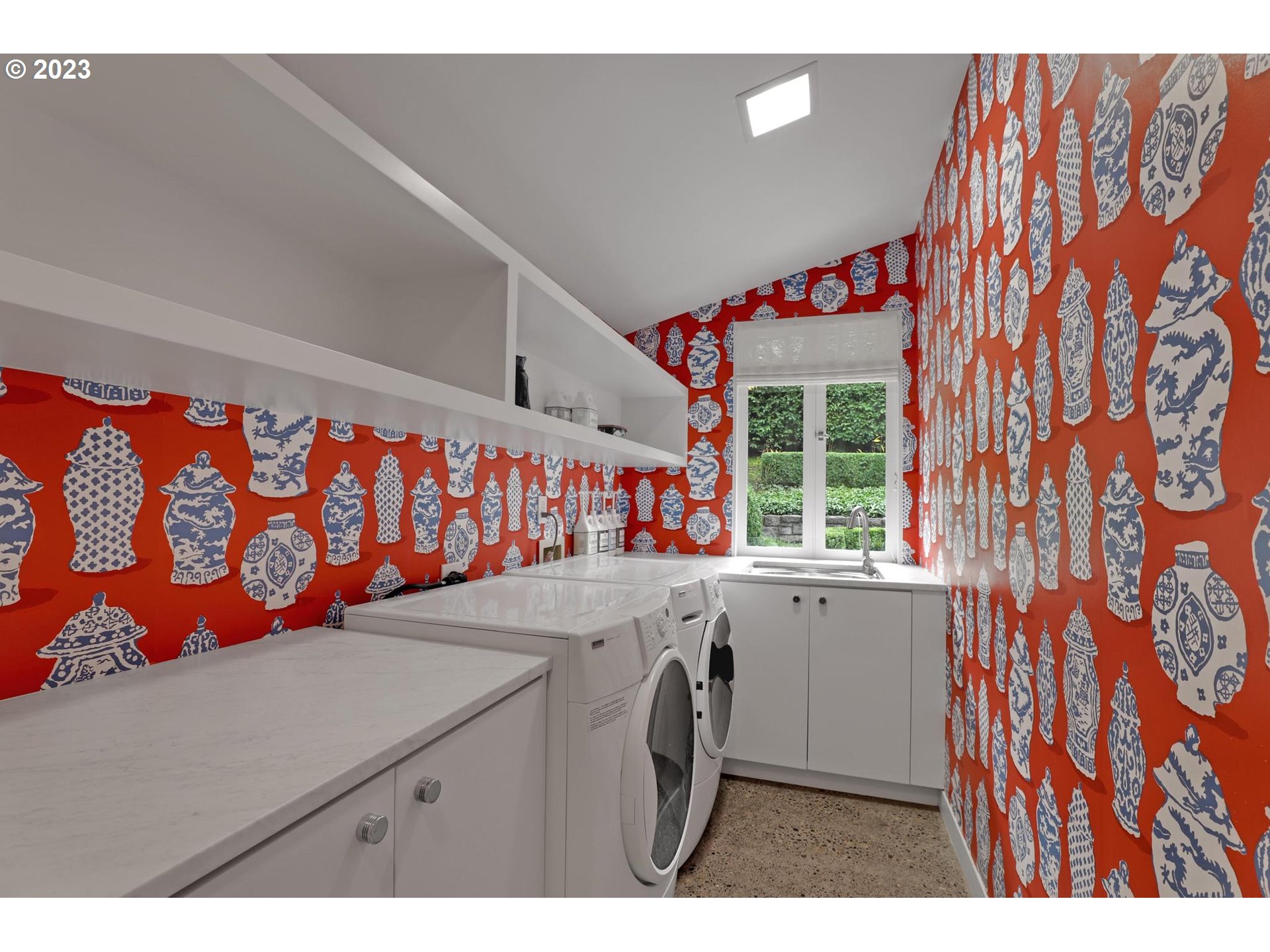 2122 Southwest Myrtle Street Portland, OR 97201 - Photo 30 of 47 a utility room with stainless steel appliances wooden floor washer and dryer