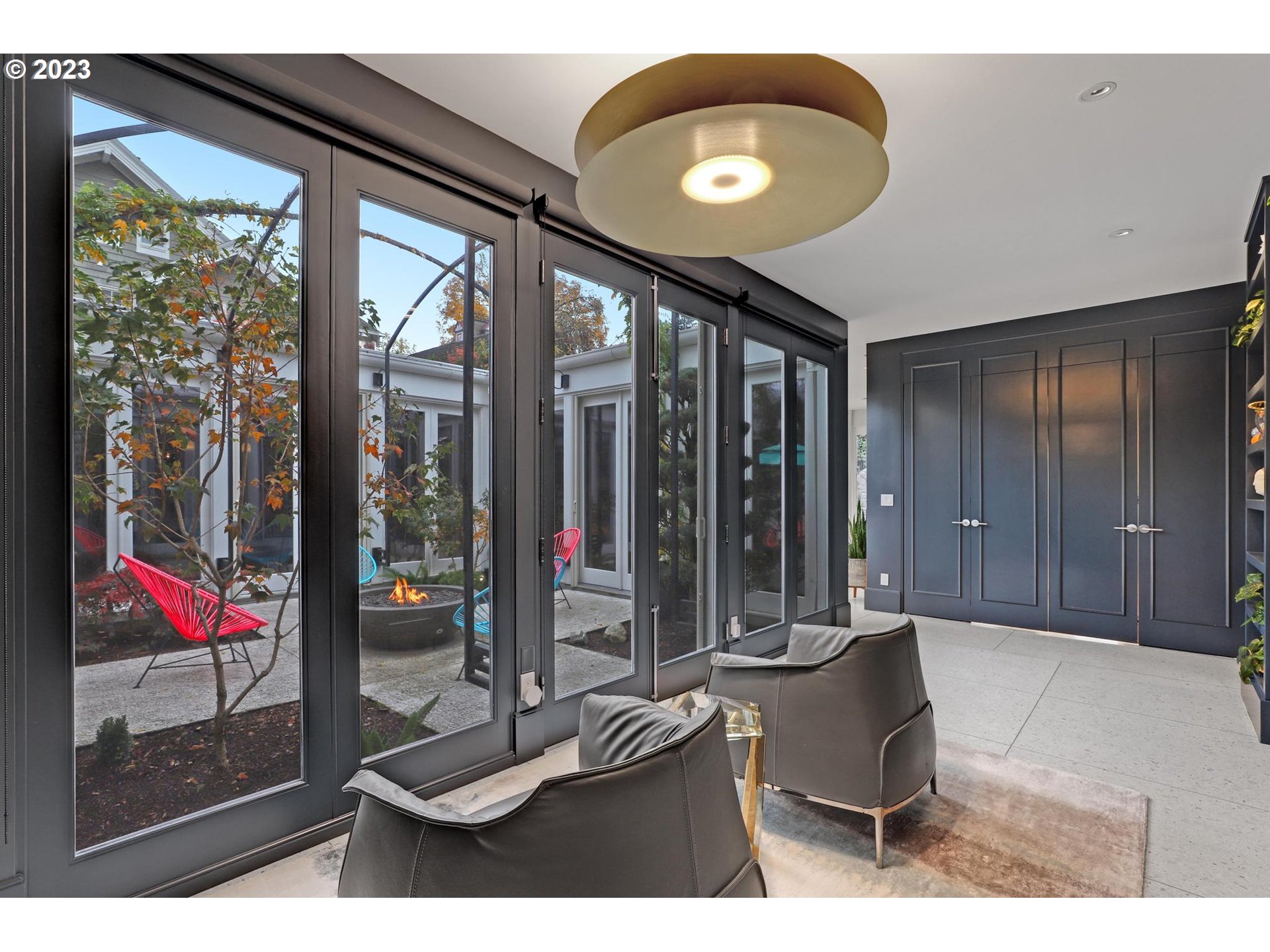 2122 Southwest Myrtle Street Portland, OR 97201 - Photo 33 of 47 a living room with furniture and a floor to ceiling window