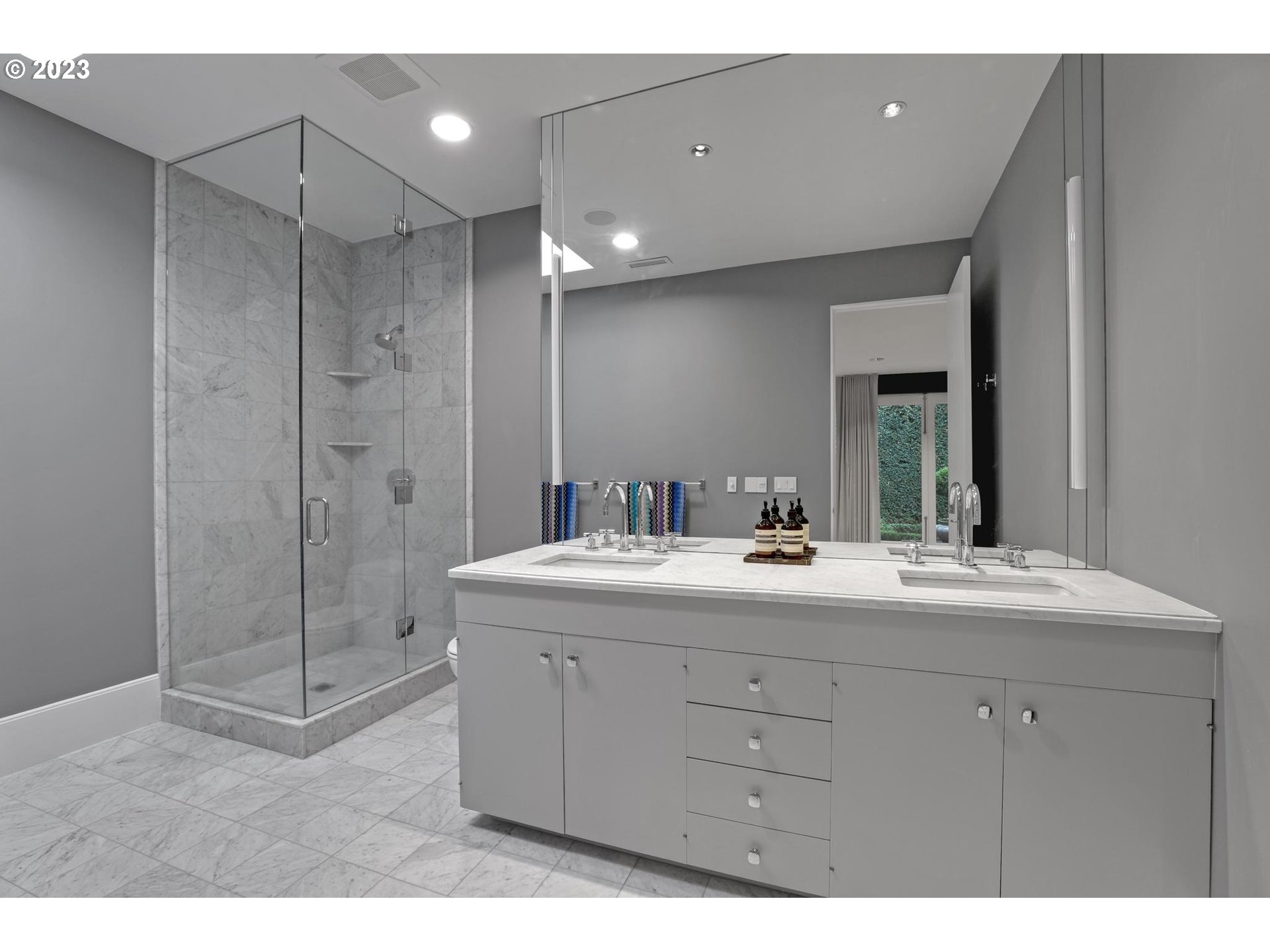 2122 Southwest Myrtle Street Portland, OR 97201 - Photo 35 of 47 a bathroom with a shower sink and mirror