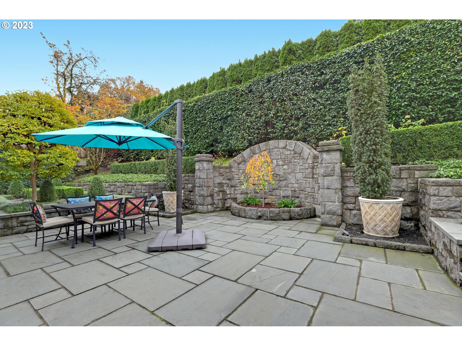2122 Southwest Myrtle Street Portland, OR 97201 - Photo 42 of 47 a view of a chairs and table under an umbrella in patio
