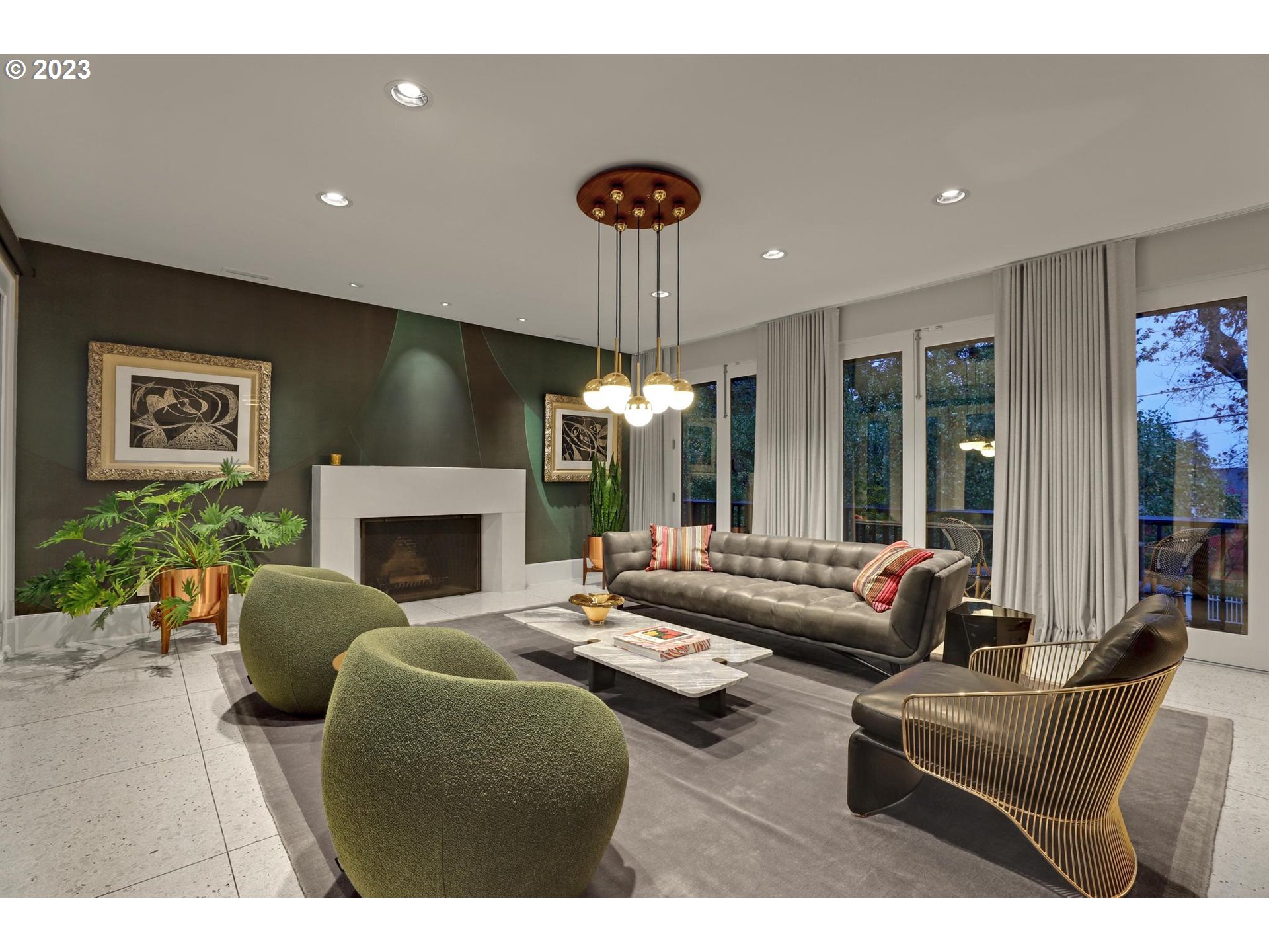 2122 Southwest Myrtle Street Portland, OR 97201 - Photo 7 of 47 a living room with furniture a chandelier and a fireplace