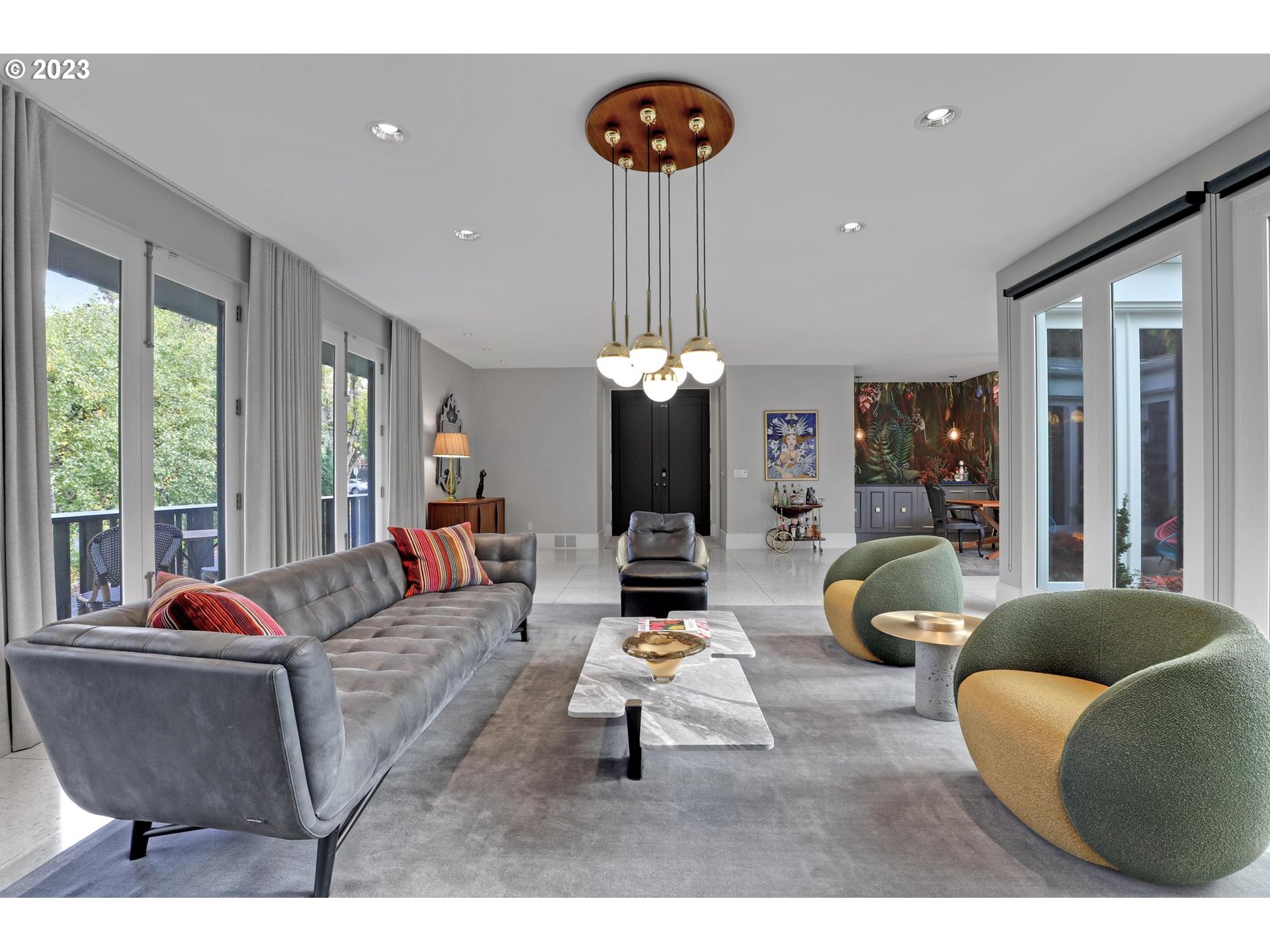 2122 Southwest Myrtle Street Portland, OR 97201 - Photo 8 of 47 a living room with furniture a chandelier and a large window