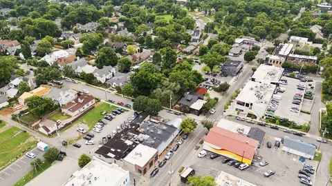 an aerial view of residential houses with outdoor space