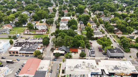an aerial view of residential houses with outdoor space