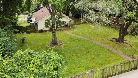 a garden view with a fountain