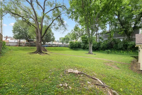 a view of a trees in front of a house